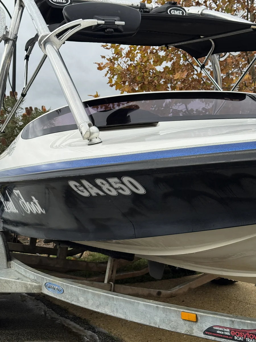 Before oxidation removal Perth — dull swirled black gelcoat hull