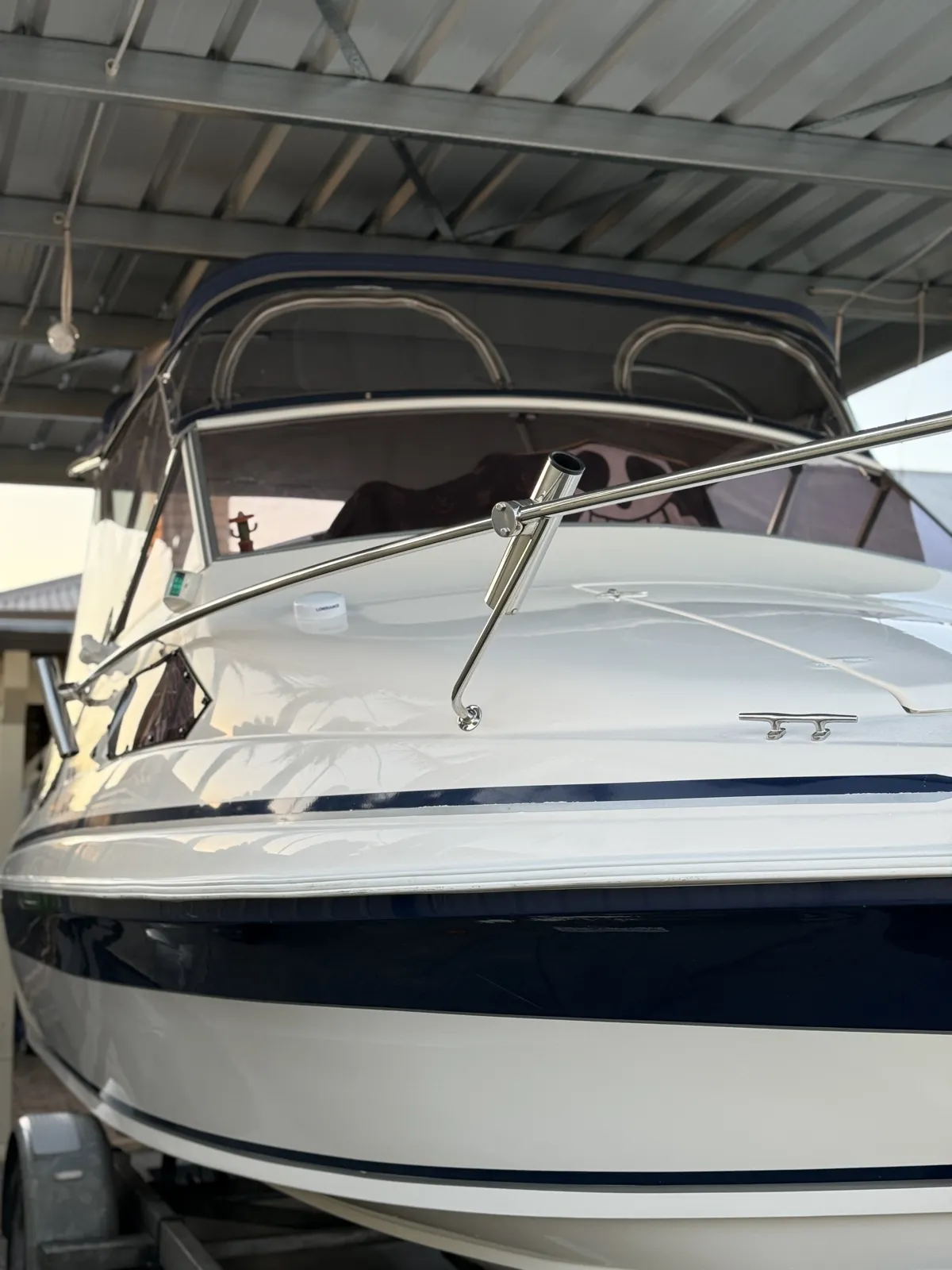 Gelcoat restoration Perth WA — Caribbean bow deck, rail and navy stripe gloss finish