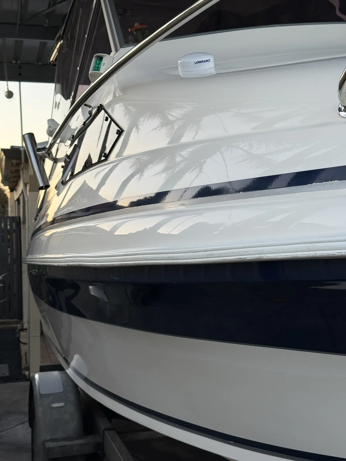 Hull polishing Perth WA — Caribbean cuddy cabin gelcoat with mirror reflections after detail