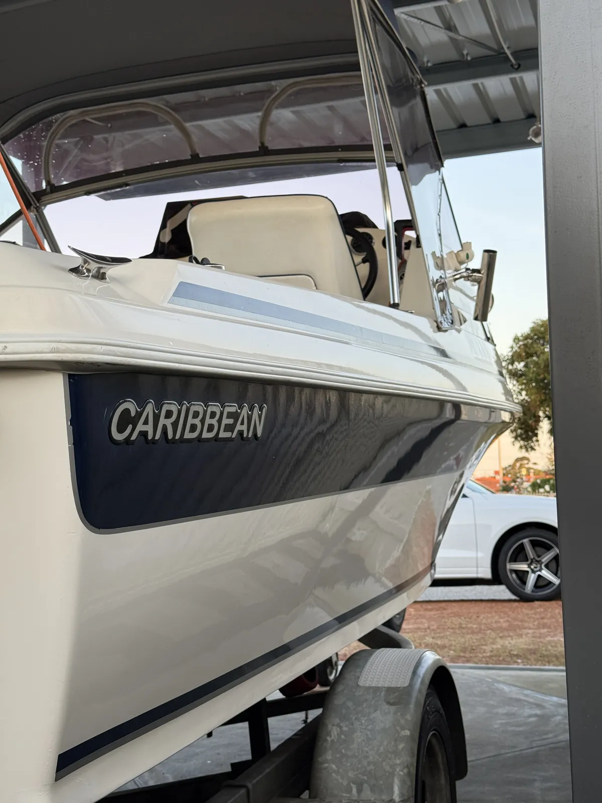 Exterior boat detailing Perth WA — Caribbean hull side and navy panel gloss finish