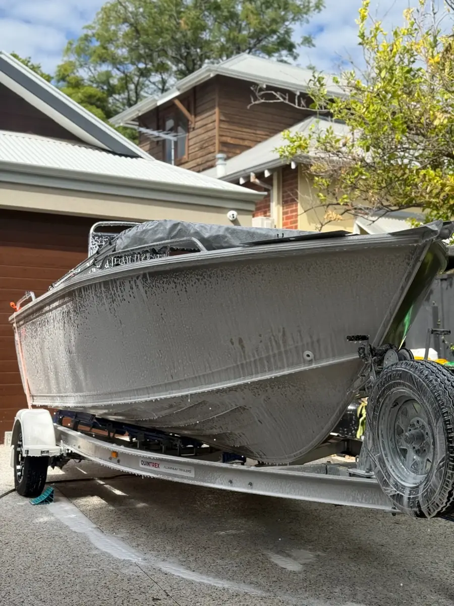 Exterior boat detailing Perth WA — Quintrex foam wash at driveway