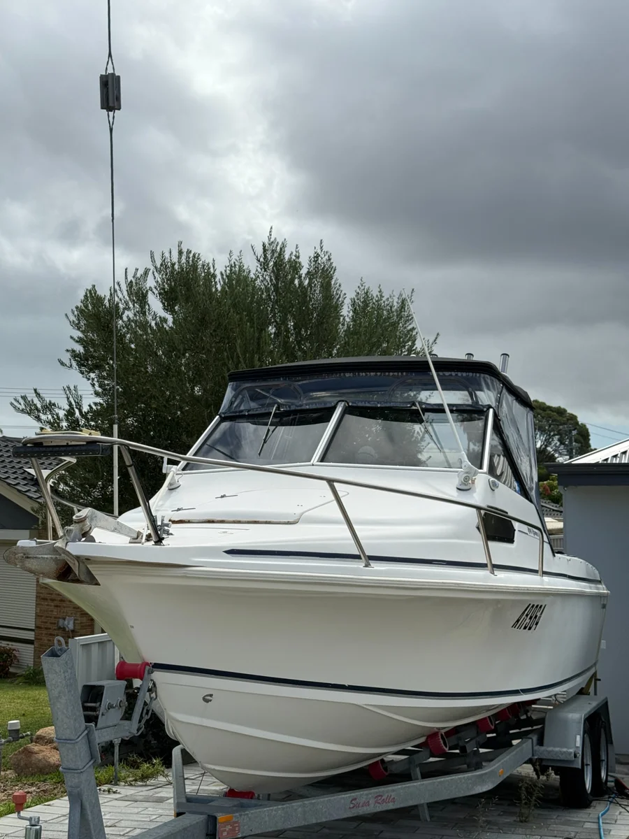 Exterior boat detailing Perth WA — walkaround cruiser on driveway